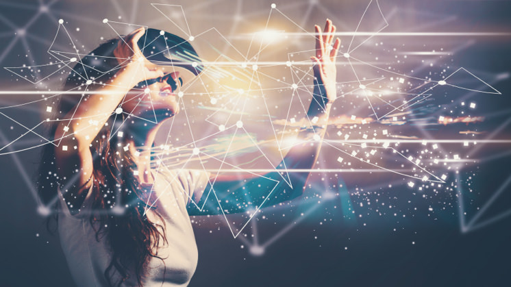 Woman using a virtual reality headset while interacting with glowing digital elements and futuristic technology visuals